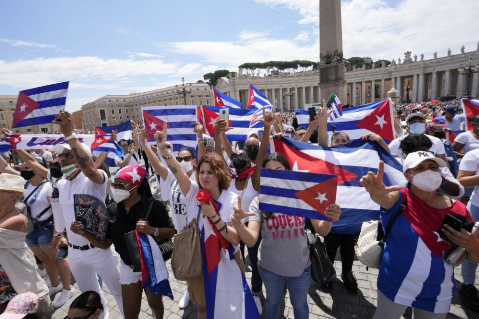 Members of Italian Cuban community show flags during Pope Francis' Angelus noon prayer from the window of his studio overlooking St. Peter's Square, at the Vatican July 18. (AP/Alessandra Tarantino)