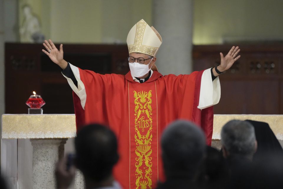 Stephen Chow waves at the episcopal ordination ceremony as the new Bishop of the Catholic Diocese, in Hong Kong, Saturday, Dec. 4, 2021. (AP Photo/Kin Cheung) Stephen Chow waves at the episcopal ordination ceremony as the new Bishop of the Catholic Diocese, in Hong Kong, Saturday, Dec. 4, 2021. (AP Photo/Kin Cheung)