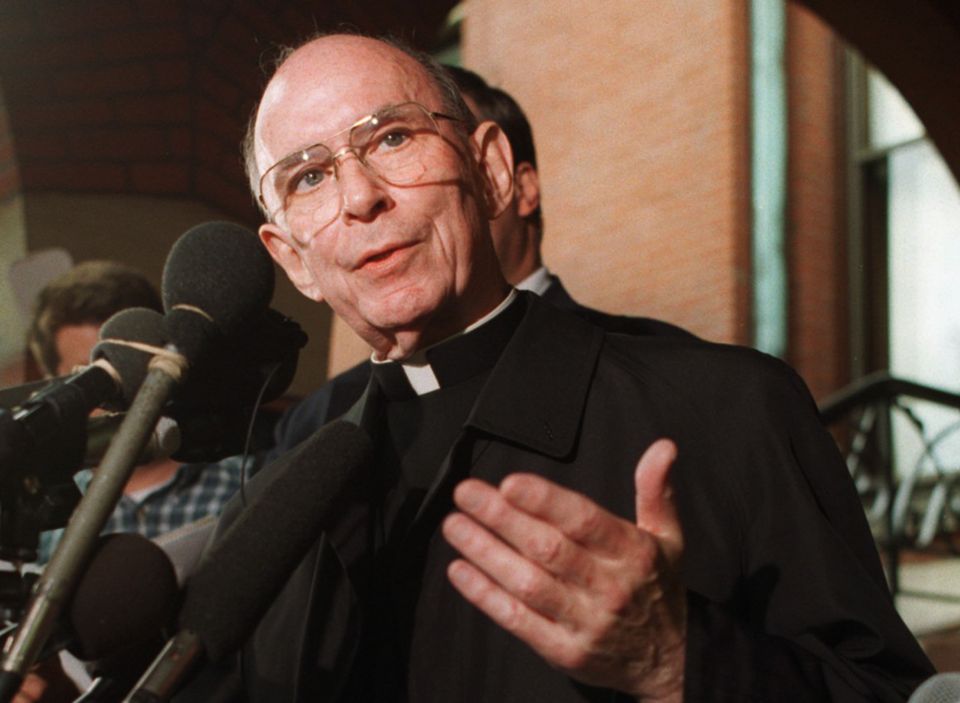 In this Sept. 23, 1996 file photo, Cardinal Joseph Bernardin speaks with reporters on the steps of his Chicago residence just before his departure for Rome to meet with Pope John Paul II. (AP Photo/Peter Barreras, File)