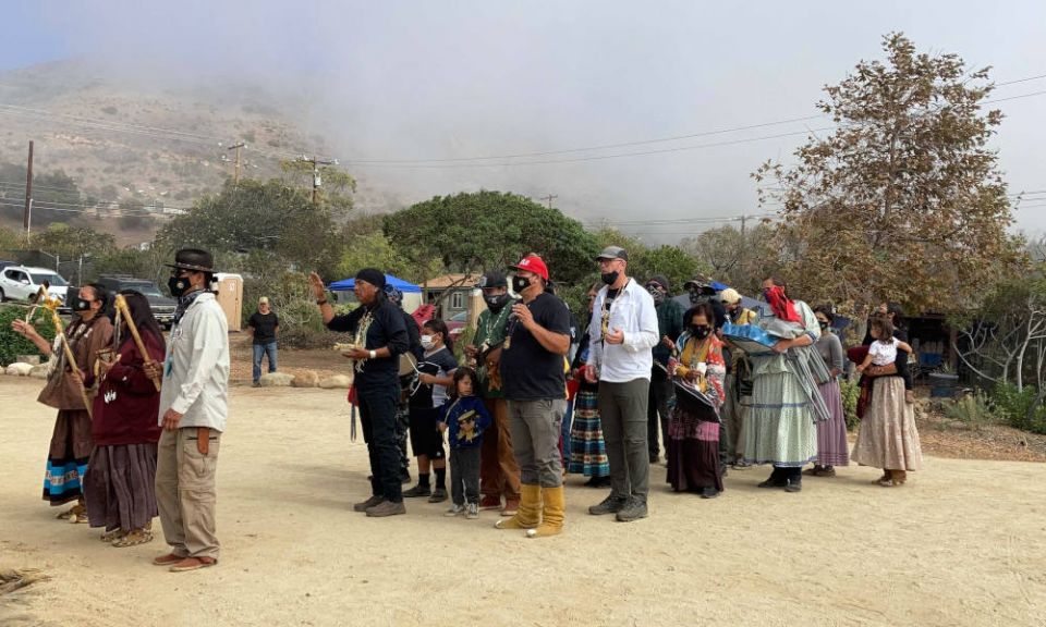 Apache Stronghold, a coalition of Apaches, other Native peoples and non-Native supporters seeking to preserve Oak Flat, arrives at Wishtoyo Chumash Village to begin a ceremonial circle, Sunday, Oct. 17, in Malibu, California. (RNS photo/Alejandra Molina)