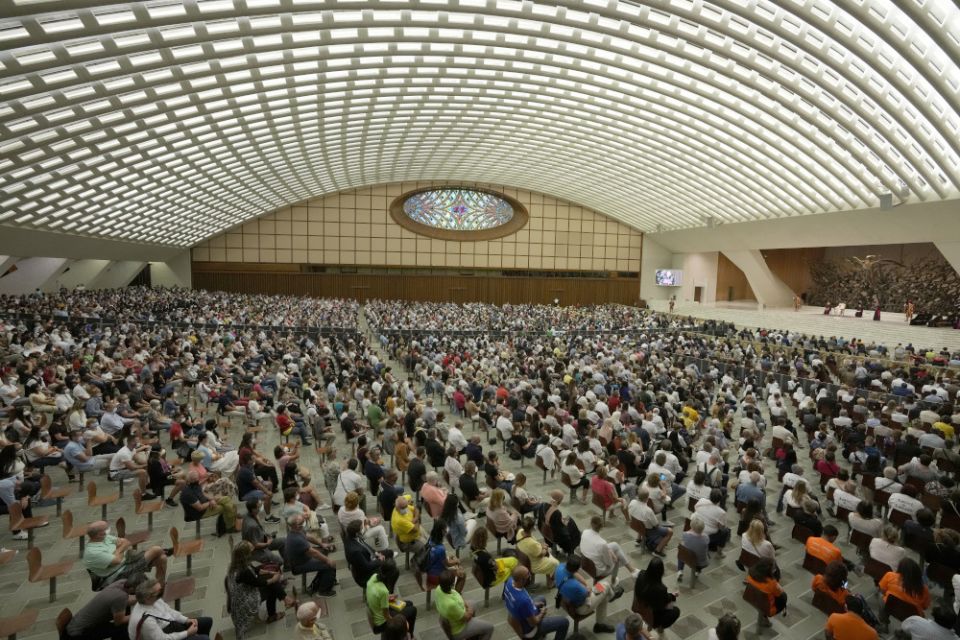 People listen to Pope Francis during his weekly general audience in Paul VI hall Sept. 8 at the Vatican. (AP/Andrew Medichini)