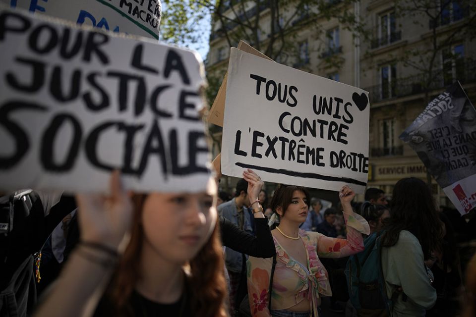Demonstrators against the French extreme right are seen in Paris April 16. (AP/Christophe Ena)