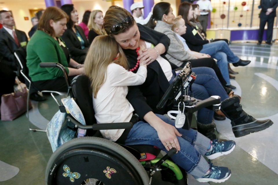 Eight-year-old Abigail Gabriel, center, hugs her mother, Erin, as Pennsylvania Department of Human Services Acting Secretary Teresa Miller talks about the Children's Health Insurance Program, CHIP, on Dec. 7, 2017, in Pittsburgh. (AP Photo/Keith Srakocic) Eight-year-old Abigail Gabriel, center, hugs her mother, Erin, as Pennsylvania Department of Human Services Acting Secretary Teresa Miller talks about the Children's Health Insurance Program, CHIP, on Dec. 7, 2017, in Pittsburgh. (AP Photo/Keith Srakocic)