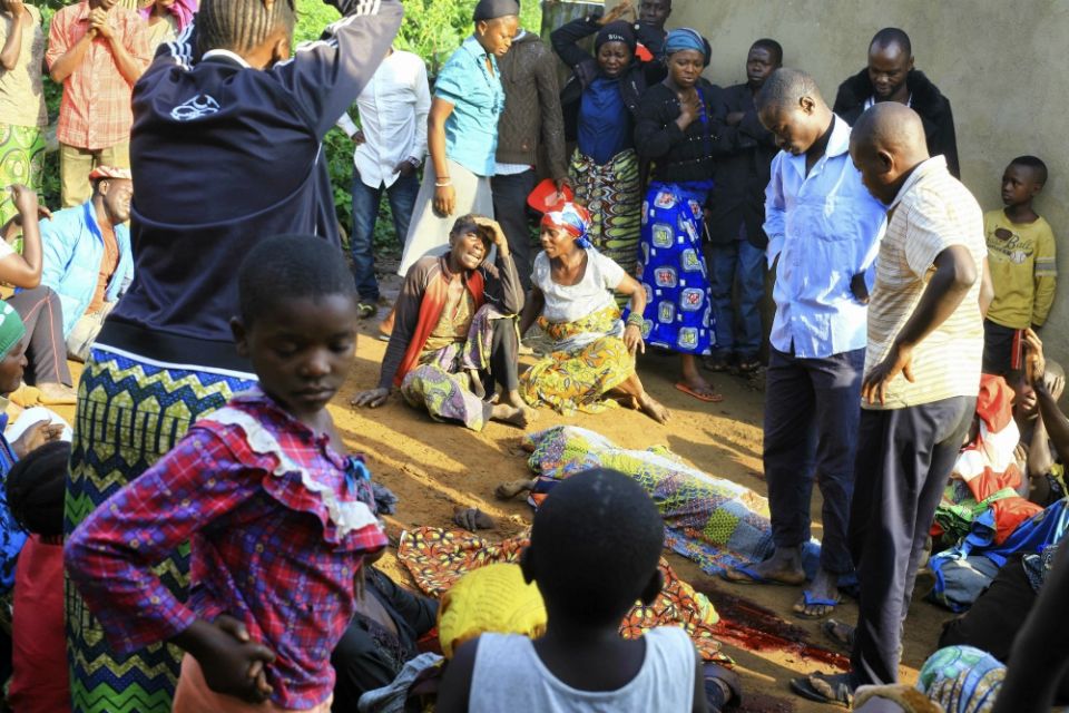 On Oct. 5, family members and onlookers mourn over bodies of civilians killed by the Allied Democratic Forces rebels in Beni, Democratic Republic of Congo. (AP Photo/Al-hadji Kudra Maliro)