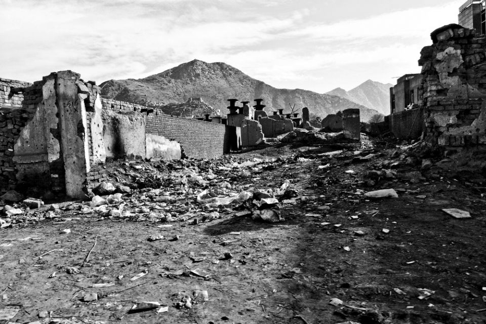 An Afghan town turned to rubble in 2007 (Wikimedia Commons/Gideon Tsang)
