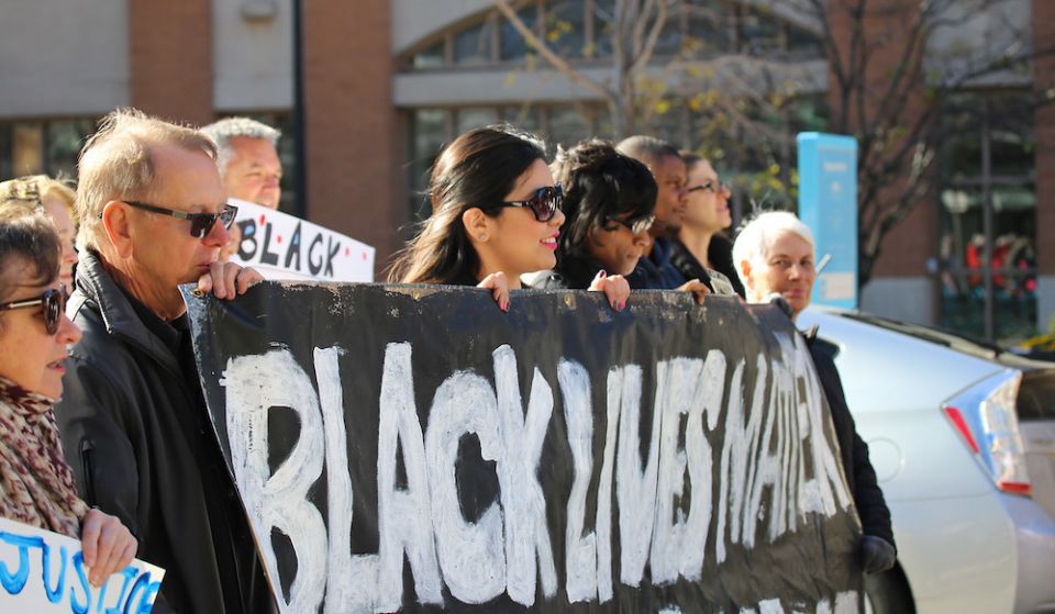 Call to Action members carry a Black Lives Matter banner at a protest during the 2015 CTA conference in Milwaukee, Wisconsin. Protestors demanded justice for Dontre Hamilton, a black man killed by Milwaukee police in 2014. At far left is CTA vision counci