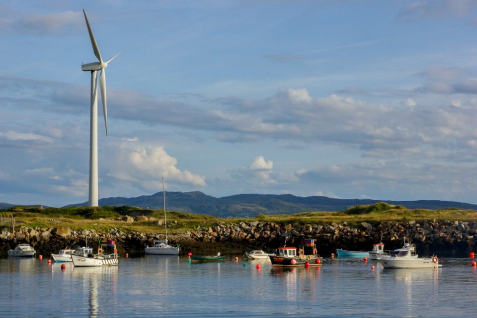 A wind turbine stands over in Burtonport, County Donegal, Ireland, in 2014. (Wikimedia Commons/Jakub Michankow)