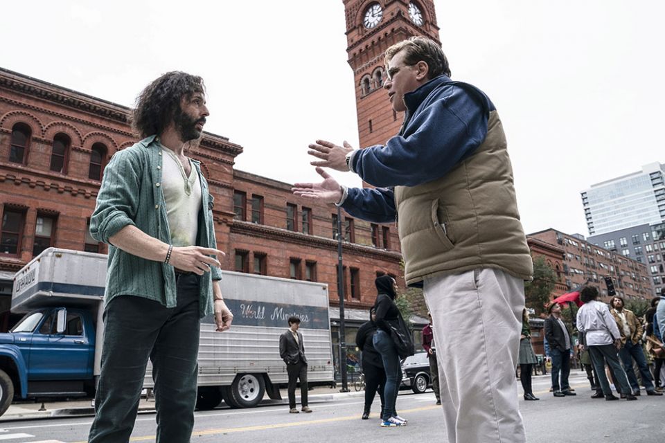 Jeremy Strong, who plays Jerry Rubin in "The Trial of the Chicago 7," with writer/director Aaron Sorkin in a production still from the film. (Netflix/Niko Tavernise)