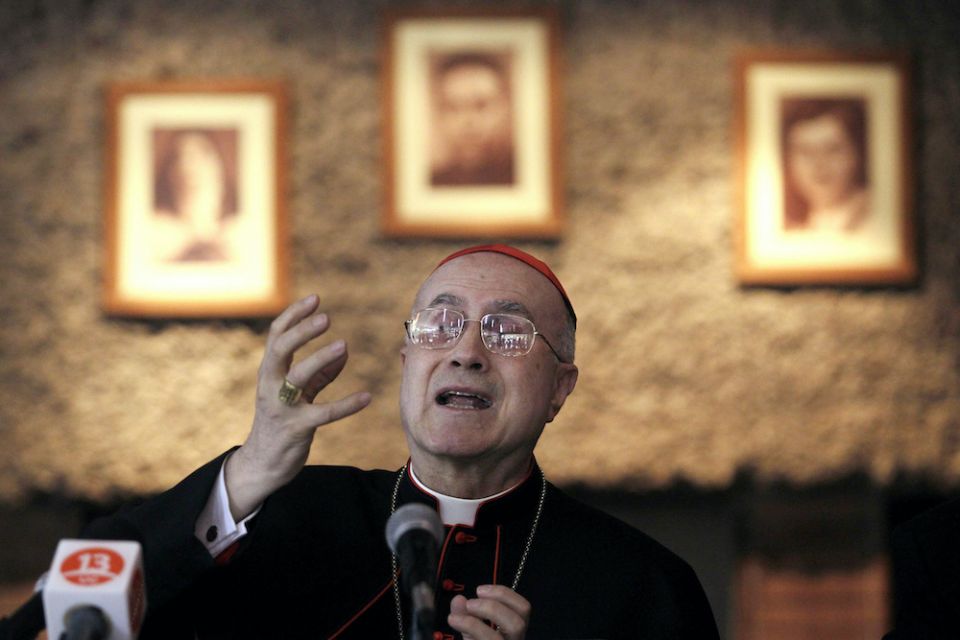 Cardinal Tarcisio Bertone, then-Vatican secretary of state, gestures during a news conference in Santiago, Chile, April 12, 2010. (CNS/Reuters/Ivan Alvarado)