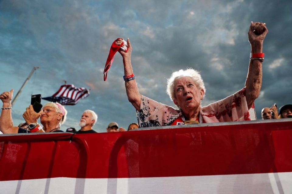 People cheer during a reelection campaign rally for President Donald Trump at Cecil Airport in Jacksonville, Florida, Sept. 24. (CNS/Reuters/Tom Brenner)