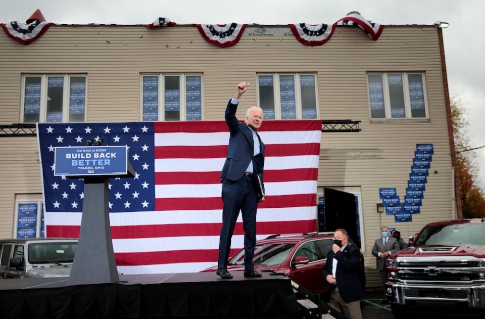Democratic presidential nominee Joe Biden raises his arm during a drive-in campaign event in Toledo, Ohio, Oct. 12. (CNS//Reuters/Rebecca Cook) Democratic presidential nominee Joe Biden raises his arm during a drive-in campaign event in Toledo, Ohio, Oct. 12. (CNS//Reuters/Rebecca Cook)