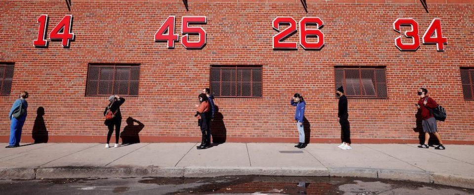 Voters in Boston wait to cast their ballots near Fenway Park on the first day of early voting Oct. 17. (CNS/Reuters/Brian Snyder)