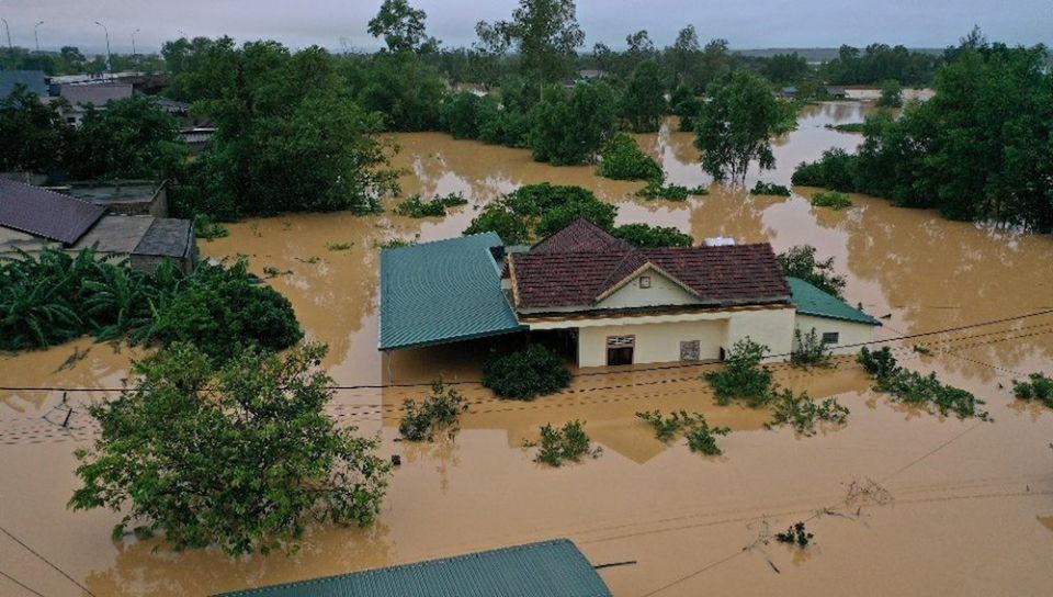Floodwaters surround a home in Vietnam's province of Quang Tri Oct. 18. Two dioceses in central Vietnam hit by some of the worst floods in the country's history are struggling to provide emergency aid for hundreds of thousands of victims. (CNS/Reuters, vi