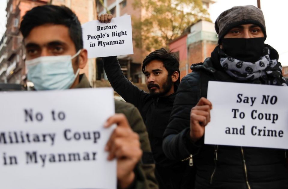 Activists hold placards during a protest in Kathmandu, Nepal, Feb. 1, 2021, after Myanmar's military seized power from a democratically elected civilian government and arrested its leaders. (CNS/Reuters/Navesh Chitrakar)
