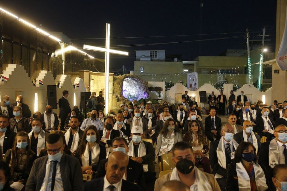 An overflow crowd is seen outside as Pope Francis celebrates Mass at St. Joseph Chaldean Catholic Cathedral in Baghdad March 6, 2021. (CNS/Paul Haring)