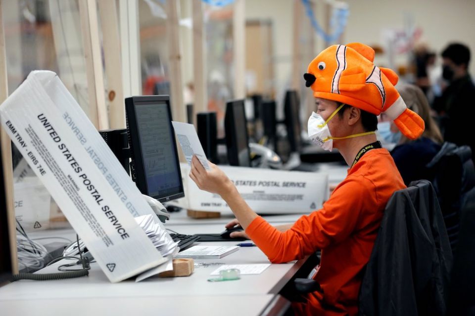 An employee in Tucson, Arizona, wears a Halloween costume Oct. 31 while processing early voting and absentee ballots ahead of the upcoming presidential election Nov. 3. (CNS/Reuters/Cheney Orr) An employee in Tucson, Arizona, wears a Halloween costume Oct. 31 while processing early voting and absentee ballots ahead of the upcoming presidential election Nov. 3. (CNS/Reuters/Cheney Orr)