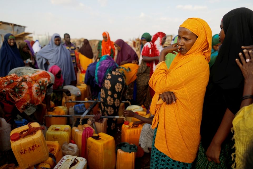 Displaced Somali women from drought hit areas wait to fill their containers at a water filling station April 3, 2017, at a camp in Dollow, Somalia. (CNS/Reuters/Zohra Bensemra)
