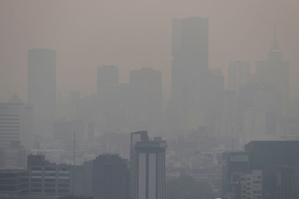 Mexico City is shrouded in smog in May 2019. (CNS/Reuters/Henry Romero)