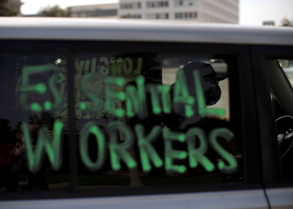 A car window in Pasadena, California, is painted with “essential workers” April 29, 2020. (CNS/Reuters/Mario Anzuoni)