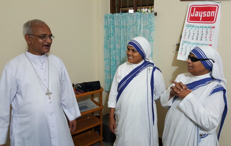In this September 2015 photo, Bishop Moses Costa of Chittagong, Bangladesh, is seen with two Missionary of Charity sisters after he celebrated morning Mass. (NCR photo/Chris Herlinger)