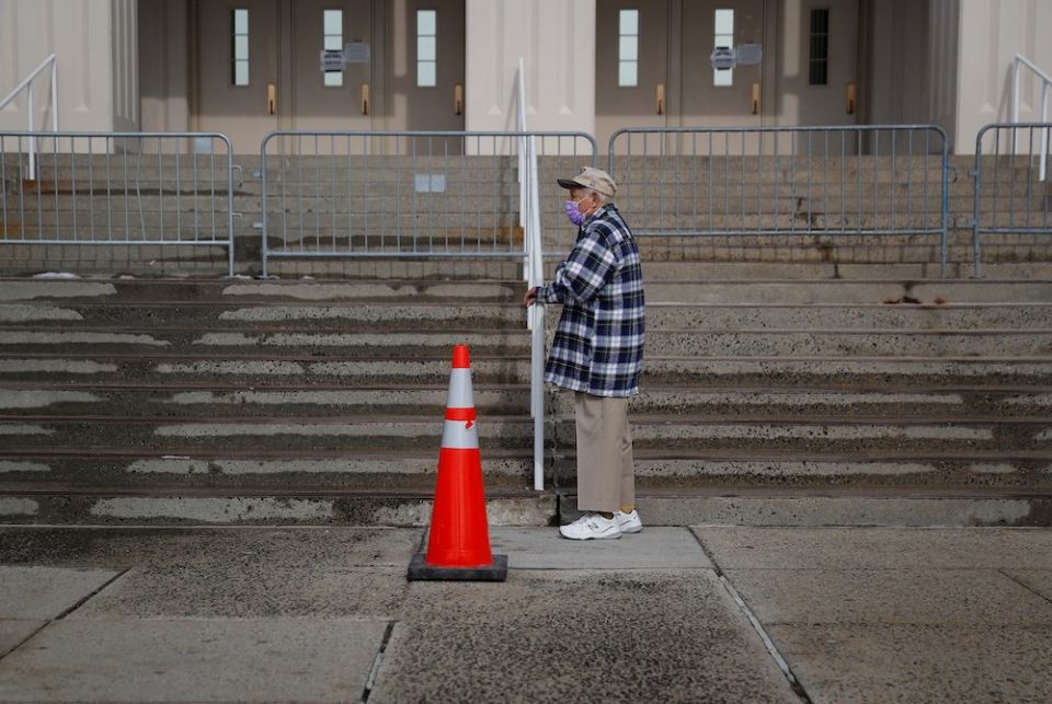 An elderly man in White Plains, New York, waits in line to receive a COVID-19 vaccine Feb. 23, 2021. (CNS/Reuters/Mike Segar)