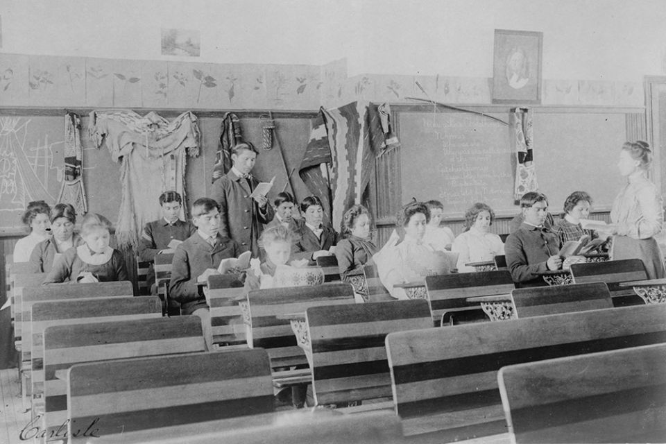 A classroom at Carlisle Indian Industrial School in Pennsylvania, circa 1901-1903 (Library of Congress)