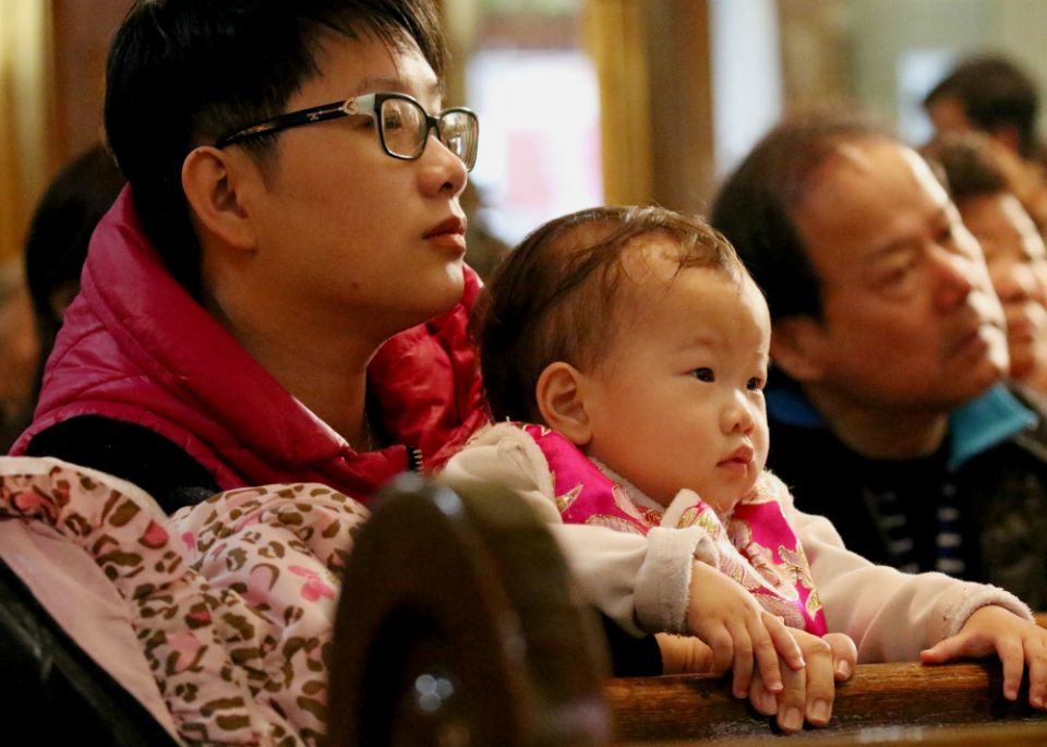 A man holds a child during Mass celebrated in February 2018 at Transfiguration Church in New York City. (CNS/Gregory A. Shemitz) A man holds a child during Mass celebrated in February 2018 at Transfiguration Church in New York City. (CNS/Gregory A. Shemitz)