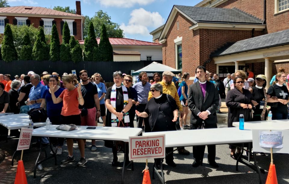 Clergy lead a gathering in song in Charlottesville, Virginia, on Aug. 12. (Flickr/Evan Nesterak) Clergy lead a gathering in song in Charlottesville, Virginia, on Aug. 12. (Flickr/Evan Nesterak)