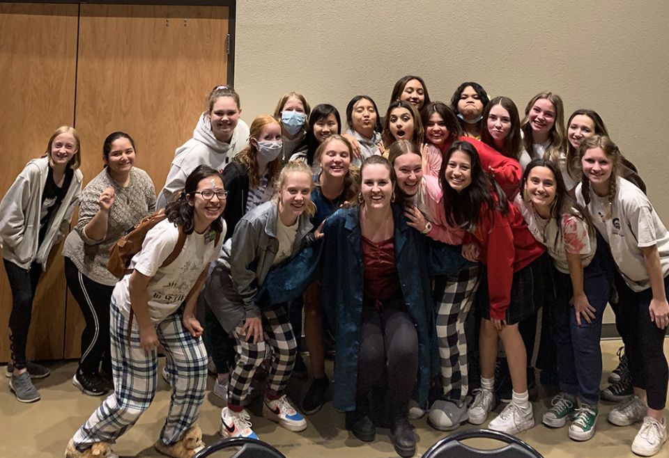 Clare McCallan poses with students at her spoken word class in Chandler, Arizona. (Courtesy of Clare McCallan)