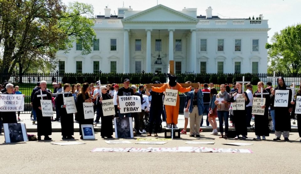 A 2017 Good Friday witness sponsored by the Dorothy Day Catholic Worker in Washington, D.C., protests "contemporary crucifixion" outside the White House. (Courtesy of Dorothy Day Catholic Worker/Art Laffin) A 2017 Good Friday witness sponsored by the Dorothy Day Catholic Worker in Washington, D.C., protests "contemporary crucifixion" outside the White House. (Courtesy of Dorothy Day Catholic Worker/Art Laffin)