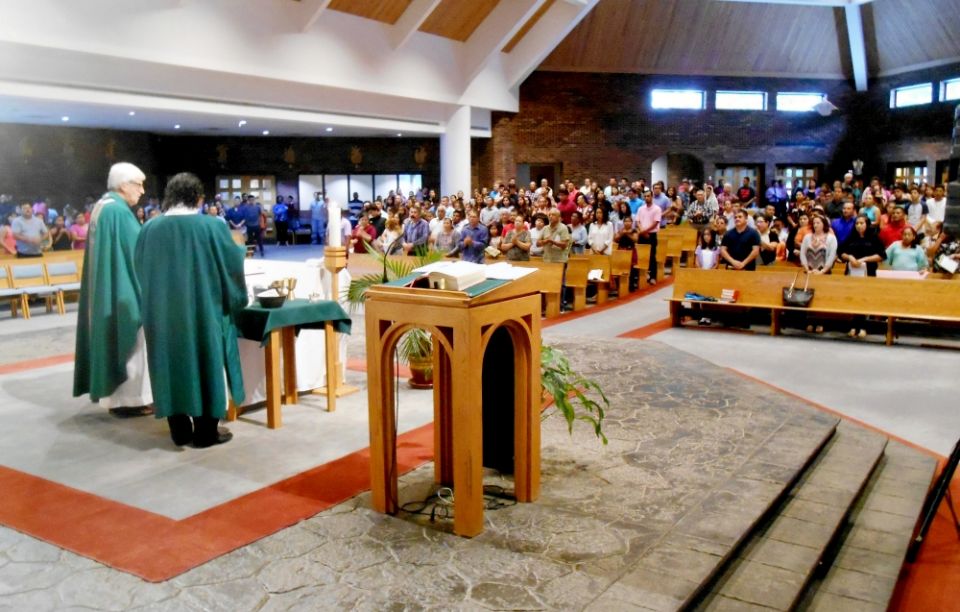 Two hours later, a Spanish-language Mass at Our Lady of the Assumption. The church is nearly filled, with at least at least five times the number of the English-language congregation.