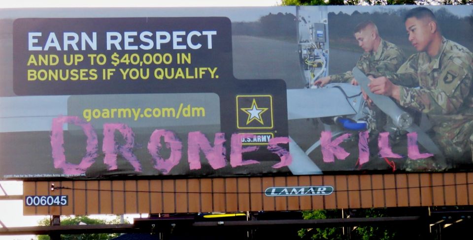 An Army billboard is seen with the words "Drones kill" in the Des Moines, Iowa, area. According to Des Moines Catholic Worker Frank Cordaro, an anonymous "Christian political artist" is targeting Army billboards in an effort to protest the use of drones. 