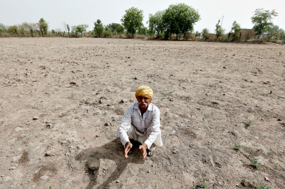 An Indian farmer sits on a dry field in May 2018 outside Chhatarpur. (CNS/EPA/Harish Tyagi) An Indian farmer sits on a dry field in May 2018 outside Chhatarpur. (CNS/EPA/Harish Tyagi)