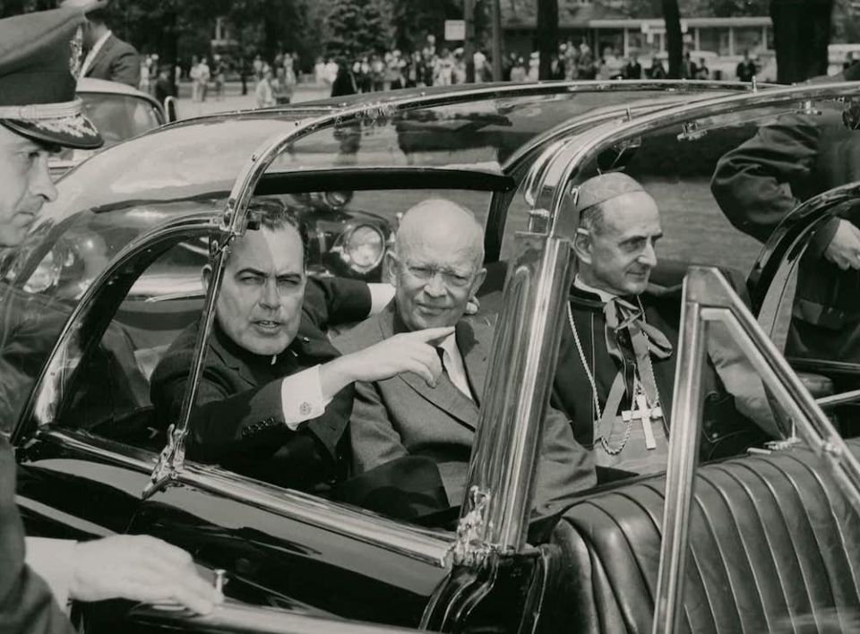 President Dwight D. Eisenhower, center, rides with Cardinal Giovanni Montini, right, a fellow honoree during the University of Notre Dame's 1960 commencement. Montini became Pope Paul VI in 1963. (Courtesy of University of Notre Dame Archives)