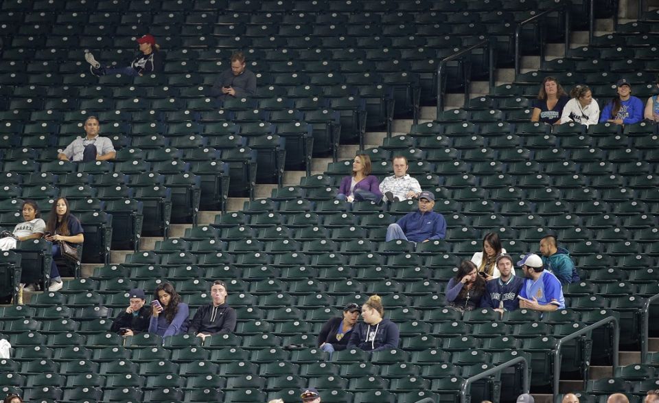 Large sections of empty seats are shown during the sixth inning of a baseball game between the Seattle Mariners and the Texas Rangers at Safeco Field, on Sept. 8, 2015, in Seattle. 