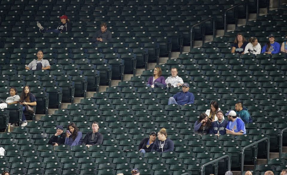 Large sections of empty seats are shown during the sixth inning of a baseball game between the Seattle Mariners and the Texas Rangers at Safeco Field, on Sept. 8, 2015, in Seattle.