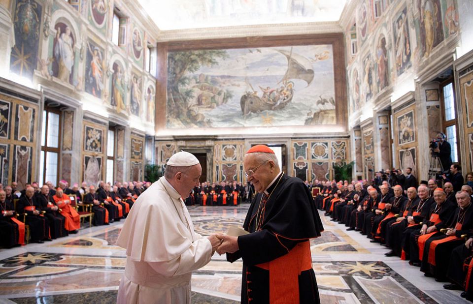 In 2018, Pope Francis greets Cardinal Angelo Sodano, then dean of the College of Cardinals, during the pope's annual pre-Christmas meeting with officials of the Roman Curia and College of Cardinals. (CNS/Vatican Media)