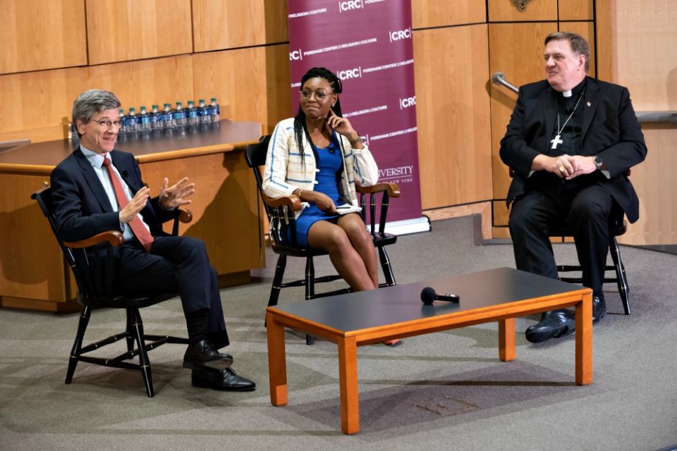 From left, Jeffrey Sachs, Christine Emba and Cardinal Joseph Tobin discuss capitalism and church social teaching at a Sept. 5 seminar at Fordham University's Lincoln Center campus in New York. (Fordham University/Leo Sorel)