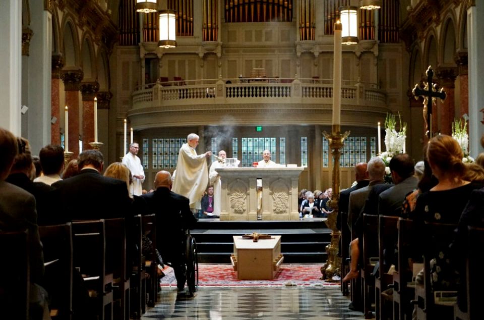 Fr. Michael Ryan, pastor of Seattle's St. James Cathedral, incenses the altar at the beginning of the Aug. 1 funeral Mass for former Seattle Archbishop Raymond Hunthausen. (M. Laughlin)