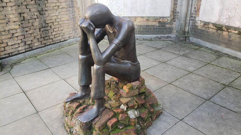 A sculpture at the remains of St. Nikolai Cathedral, which was largely destroyed during the 1943 Allied firebombing of Hamburg, Germany, mourns the horrors of war. (NCR photo/Chris Herlinger)