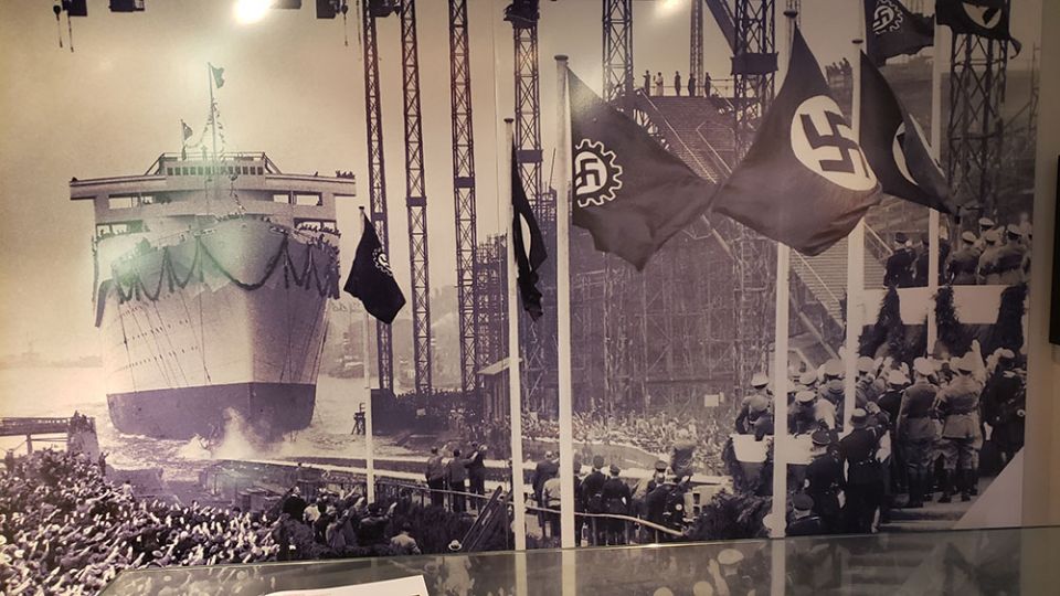 A photograph at the Hamburg Museum shows crowds celebrating the launch of a ship in Hamburg, Germany, during the Nazi era. (NCR photo/Chris Herlinger)