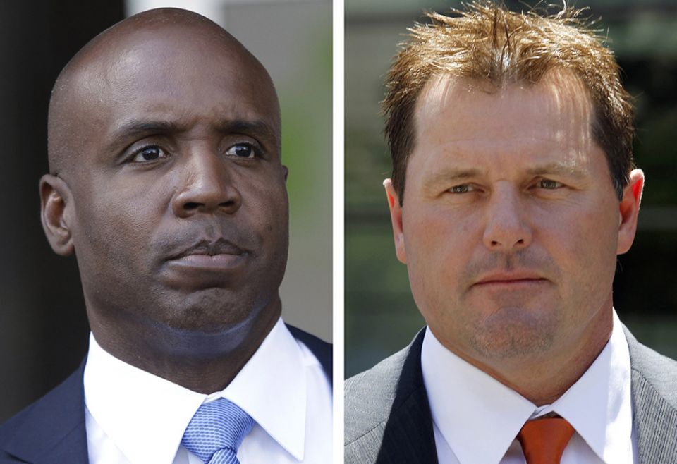 At left, in a 2011 file photo, former San Francisco Giants baseball player Barry Bonds leaves federal court in San Francisco; at right, in a 2011 file photo, former Major League baseball pitcher Roger Clemens leaves federal court in Washington. (AP)
