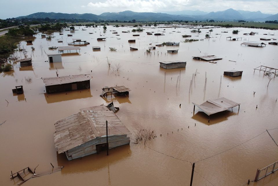 The town of Pimienta, Honduras, was flooded during Hurricane Iota in November 2020. While a lot of people were prepared, the flash flooding caught many by surprise and they lost all their belongings. (Photo courtesy of Sean Hawkey, World Council of Church The town of Pimienta, Honduras, was flooded during Hurricane Iota in November 2020. While a lot of people were prepared, the flash flooding caught many by surprise and they lost all their belongings. (Photo courtesy of Sean Hawkey, World Council of Church