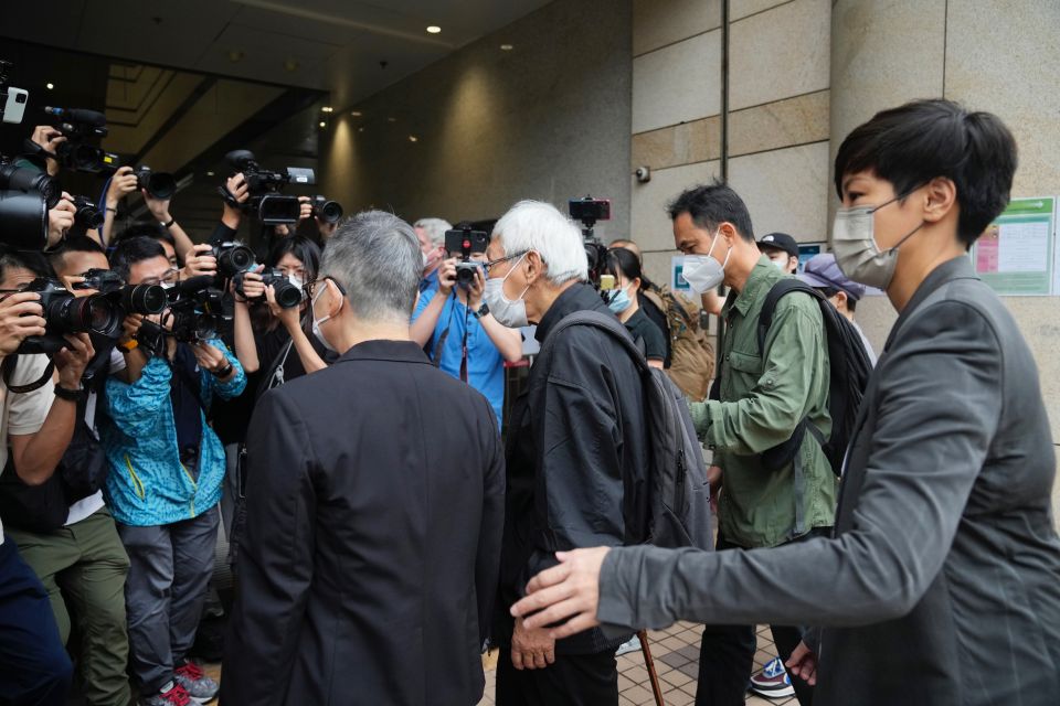 From right, Hong Kong singer Denise Ho, Hong Kong scholar Hui Po-keung, Catholic Cardinal Joseph Zen and barrister Margaret Ng and arrive for an appearance at a court in Hong Kong as they were charged in relation to their past fundraising for activists, T