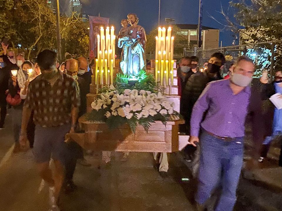 Several men carry a large statue of St. Joseph during the 2021 St. Joseph's Day procession hosted by St. Joseph Catholic Church in Houston. (Courtesy of Virginia Fraguio) Several men carry a large statue of St. Joseph during the 2021 St. Joseph's Day procession hosted by St. Joseph Catholic Church in Houston. (Courtesy of Virginia Fraguio)