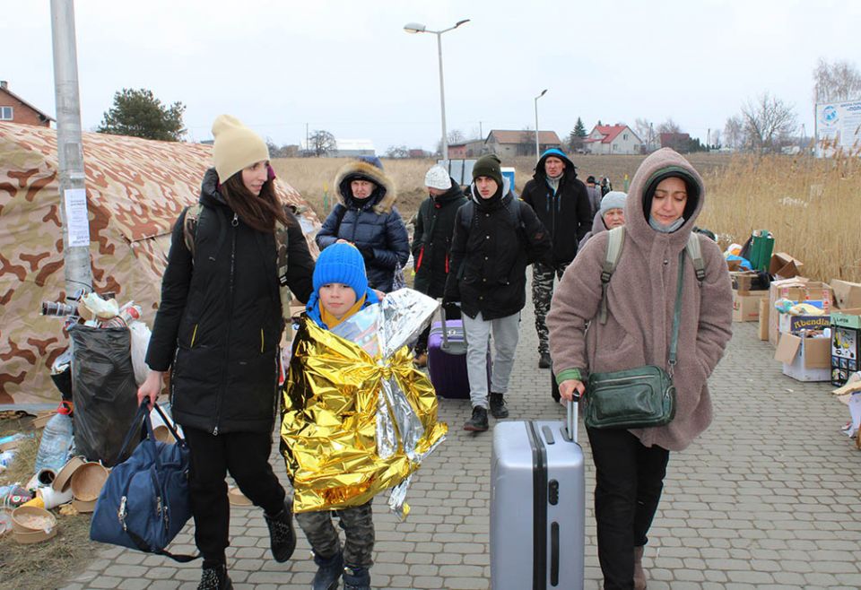 Ukrainian refugees after crossing the Ukrainian-Polish border near Przemyśl, Poland (NCR photo/Chris Herlinger)
