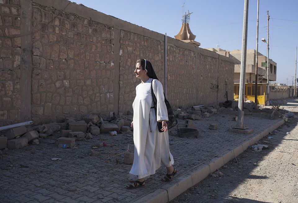 Dominican Sr. Luma Khudher on the streets of Qaraqosh in Iraq in November 2016, a few days after the city was liberated from Islamic State control (NCR photo/Eugenio Grosso)