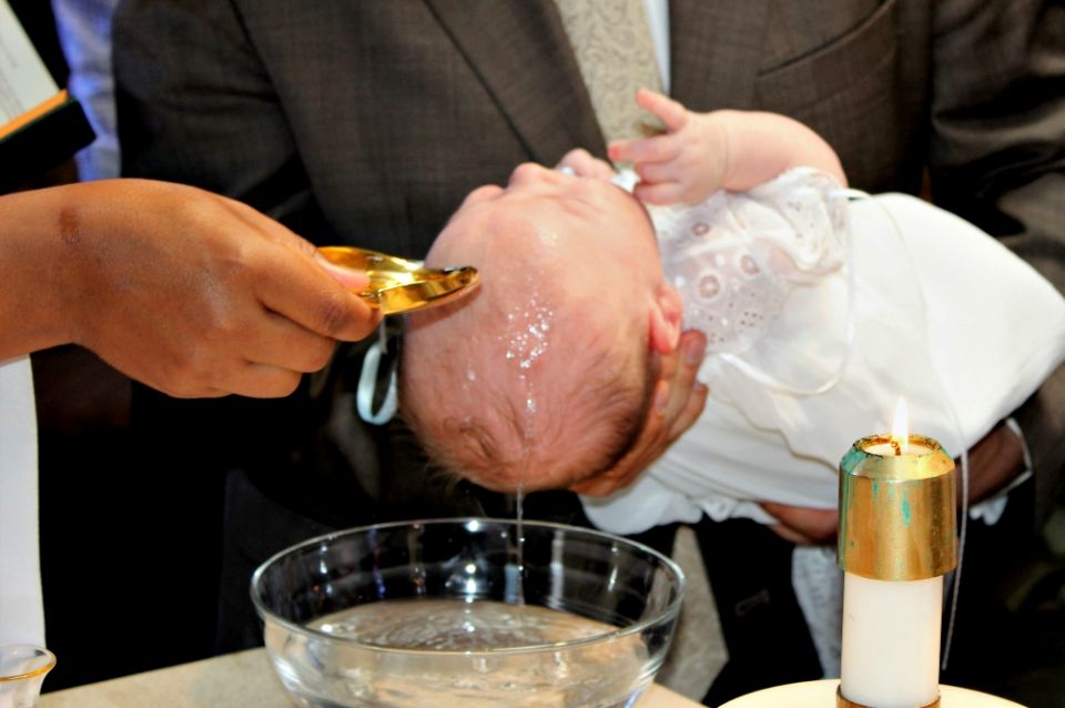 The baptism of George DeSales Piper on Oct. 1 at St. Barnabas Parish in Chicago (Provided photo)