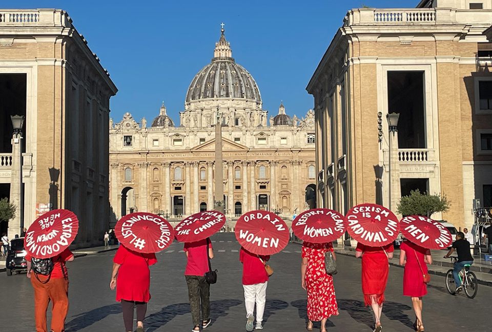 Women's ordination advocates walk towards St. Peter's Square as part of a witness on Aug. 29. (NCR photo/Christopher White)