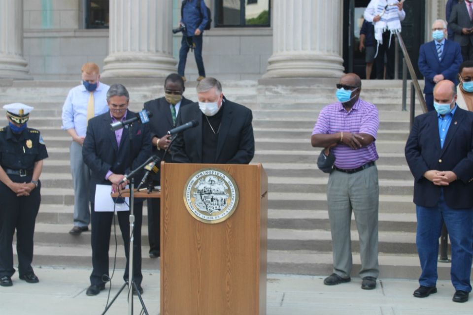 Bishop Mitchell Rozanski prays during an interfaith vigil for healing and hope held on the steps of City Hall in Springfield, Massachusetts, June 2. (Springfield-MA.gov)